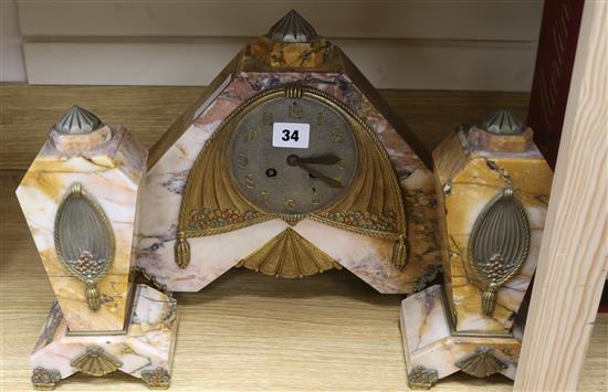 An art deco 3 piece rouge marble clock garniture H.29cm